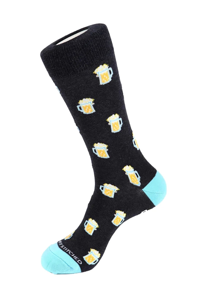 Men’s dark blue crew sock with yellow beer mug pattern and light blue heel and toe, product photo for The Simple Man beer socks.