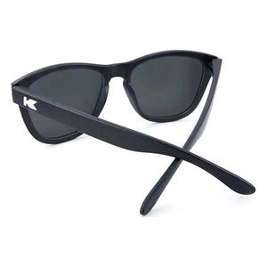 Premiums sunglasses in black with green moonshine lenses, back view, The Simple Man
