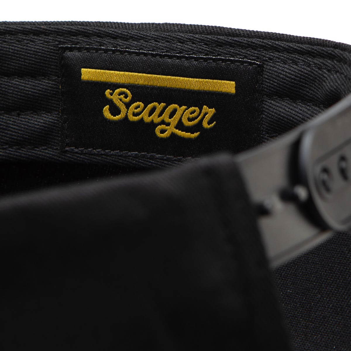 Interior Seager tag with Hey Good Lookin detail on black snapback hat