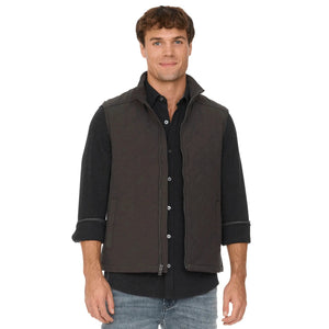 Man wearing the charcoal flannel-lined quilted vest with jeans, front view
