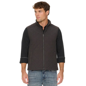 Charcoal quilted vest on a model, angled view showing the stand collar and side welt pocket