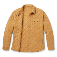 Flat lay of Corduroy Quilted Shacket in Camel, snap front partly open to show diamond quilted lining - The Simple Man