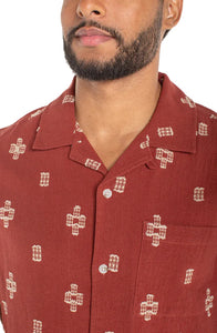Men's red cotton jacquard camp shirt – close-up of camp collar, chest pocket, and woven geometric cross motif detail