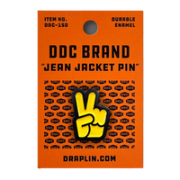 Draplin Design Co. DDC-187 Peace Fingers yellow enamel lapel pin on orange DDC Brand Jean Jacket Pin card — Yonder Yellow Burly Black enamel pin