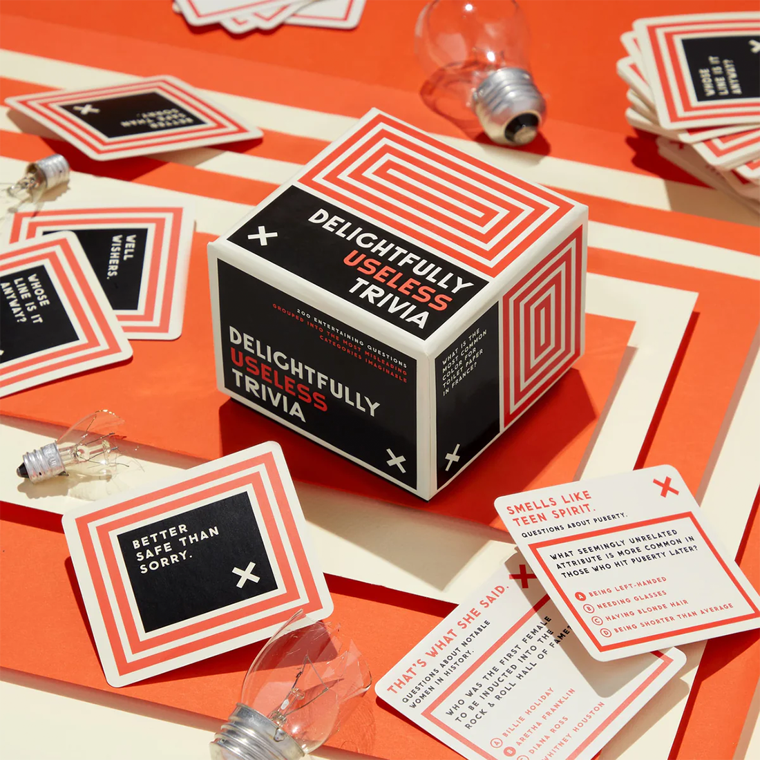 Delightfully Useless Trivia box open showing 200 trivia cards stacked inside