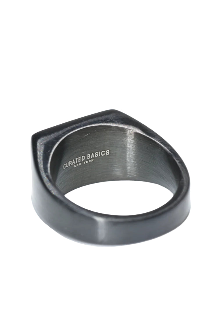 Inside view of men’s black stainless steel flat top ring engraved with Curated Basics New York – available at The Simple Man