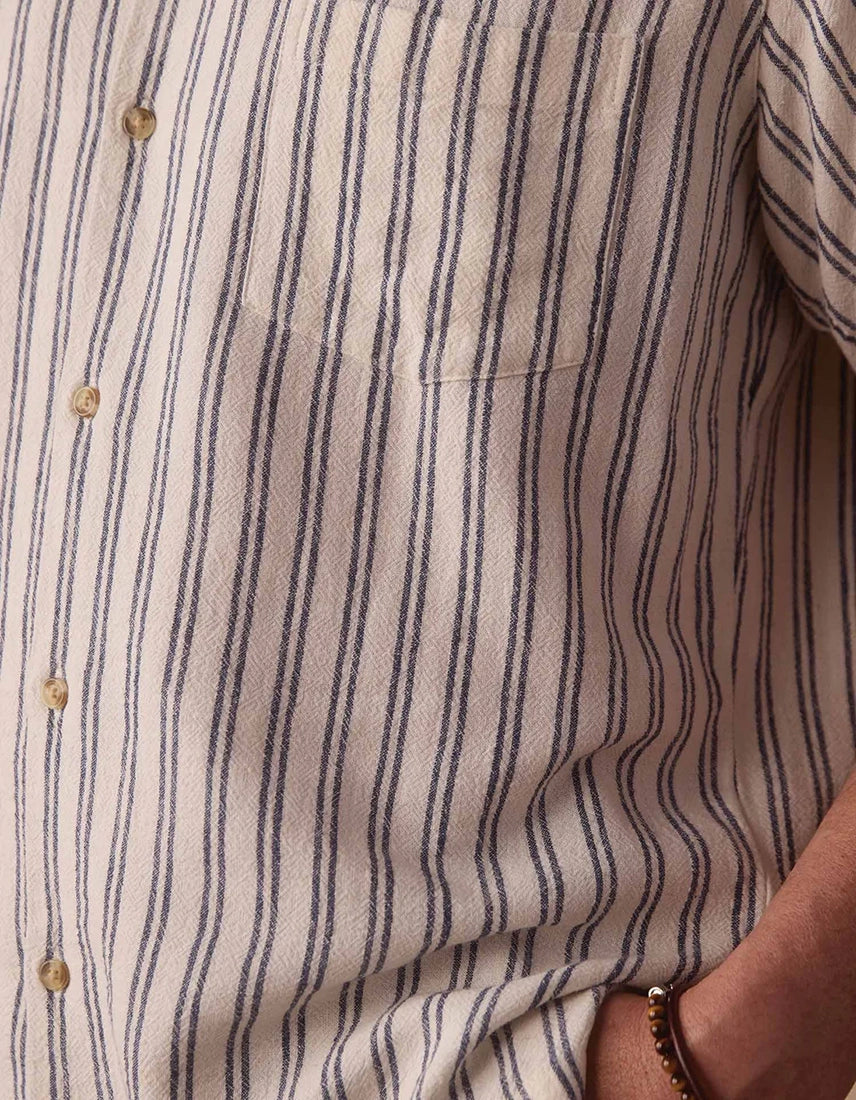 The Normal Brand Freshwater Resort Shirt Vintage Blue Stripe – close-up of chest pocket, engraved buttons, and linen rayon stripe fabric detail