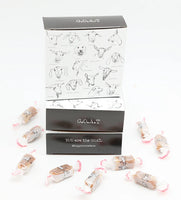 Big Picture Farm G.O.A.T. caramel box open with Sea Salt Vanilla caramels scattered — You Are the GOAT Vermont farmstead goat milk caramels white background