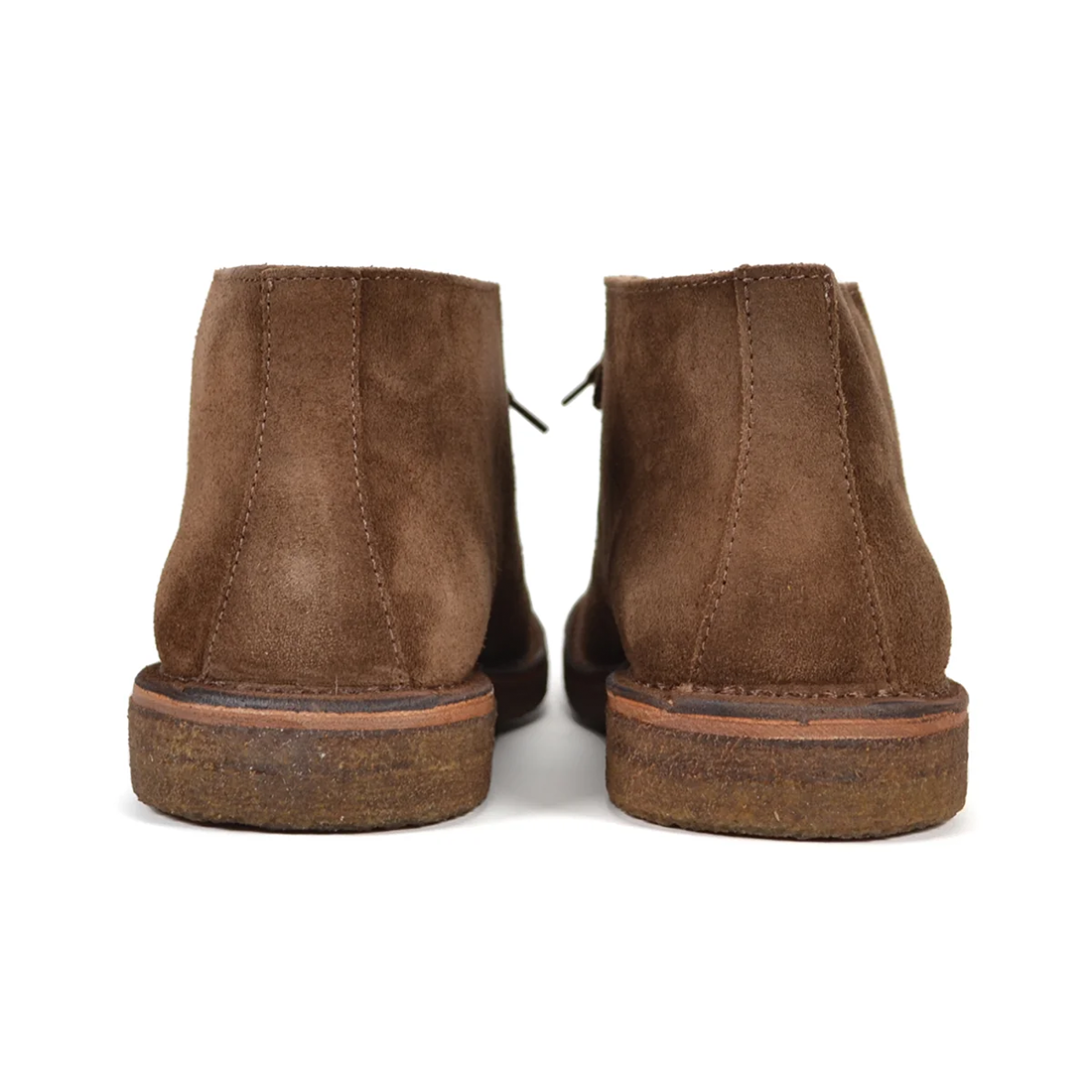 Heels of the dark khaki Greenflex chukka showing the leather welt and crepe sole, back view, The Simple Man