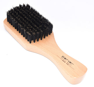 Top-angle view of the Parker boar bristle hairbrush with dense black bristles and a beechwood handle