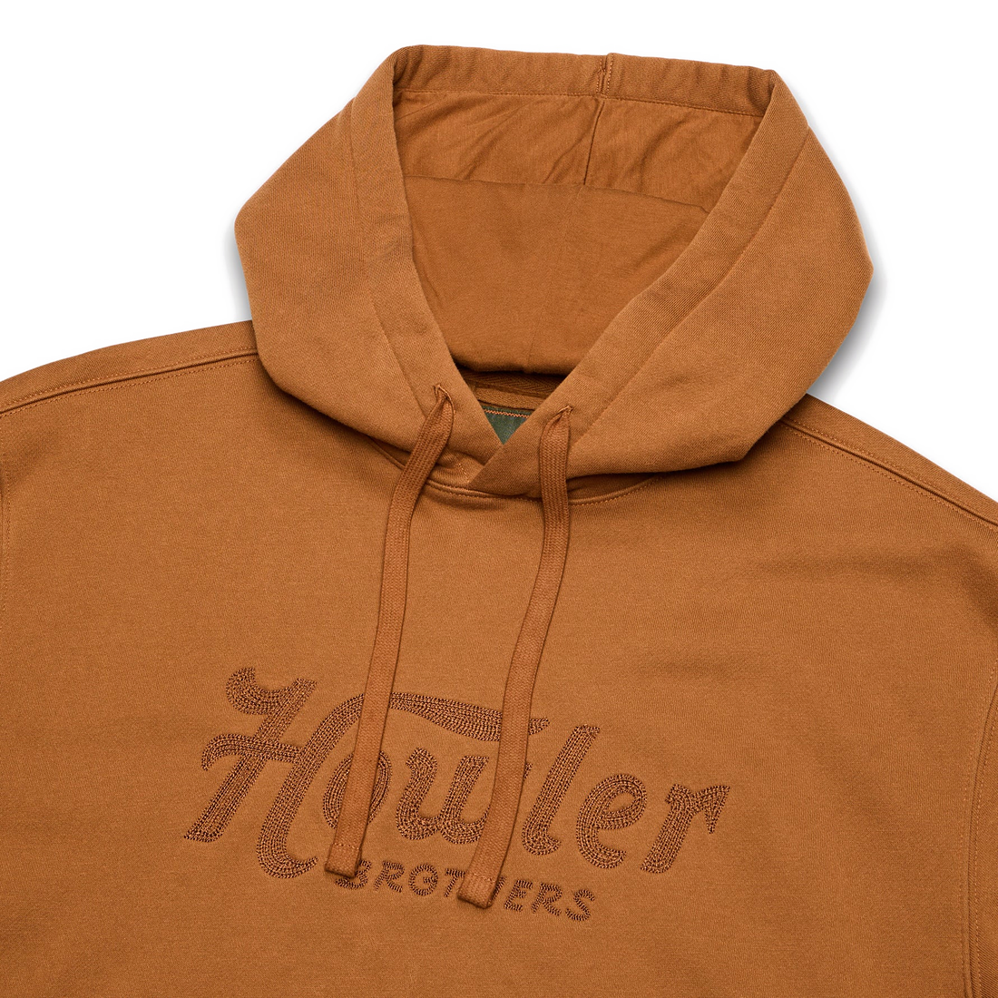 Close up of Trade hoodie hood, drawcord and chest embroidery in Workbench
