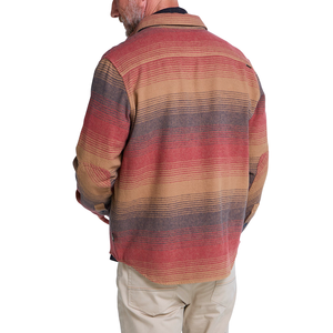 Back view of Sunset gradient stripe blanket flannel shirt on a man