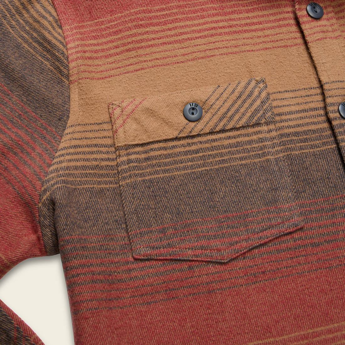 Detail of heavyweight cotton blanket flannel pocket and button in Sunset stripe
