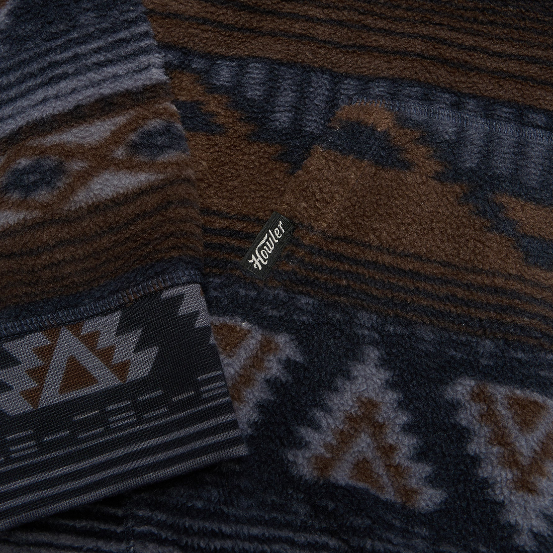 Detail of reverse printed fleece cuff and tag on Tajima hoodie in Winter Sky