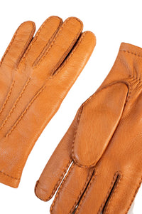Close-up of Hestra Matthew deerskin gloves cork color showing handstitched seams and texture