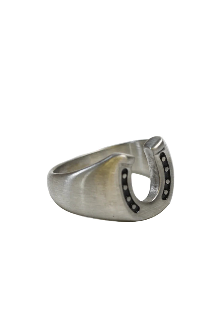 Men’s steel horseshoe ring with black inlay detail, durable minimalist accessory symbolizing luck and strength — available at The Simple Man Omaha.