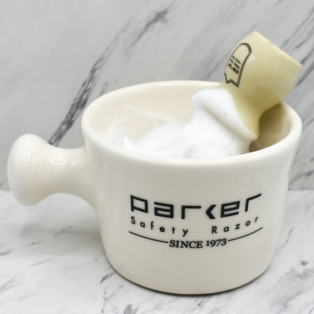 Parker Ivory stoneware shave mug creating lather with shaving brush, traditional wet shaving gear from The Simple Man