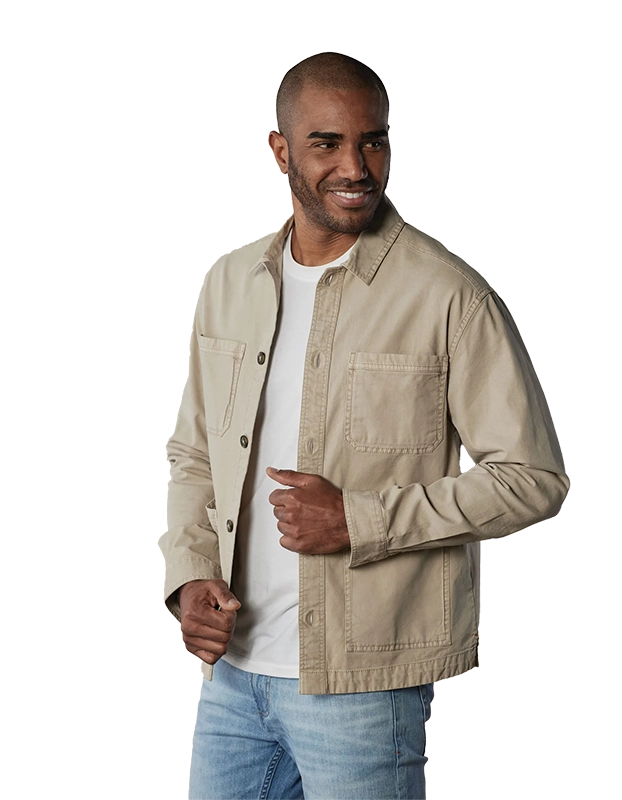 Model Wearing The Normal Brand, James Canvas Overshirt in sand dune color, Front view.