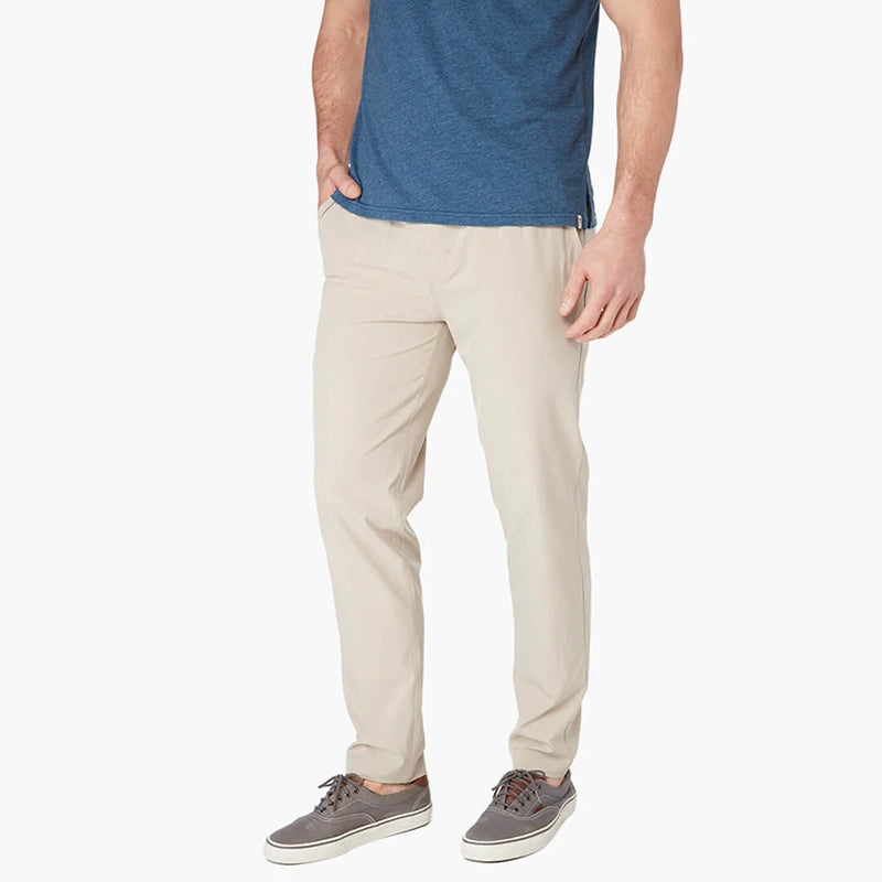 Model Wearing Fair Harbor One Pant in khaki, front angled  view