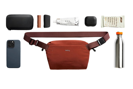 Bellroy Lite Sling Mini in Clay colorway, shown with contents to illustrate what will fit inside