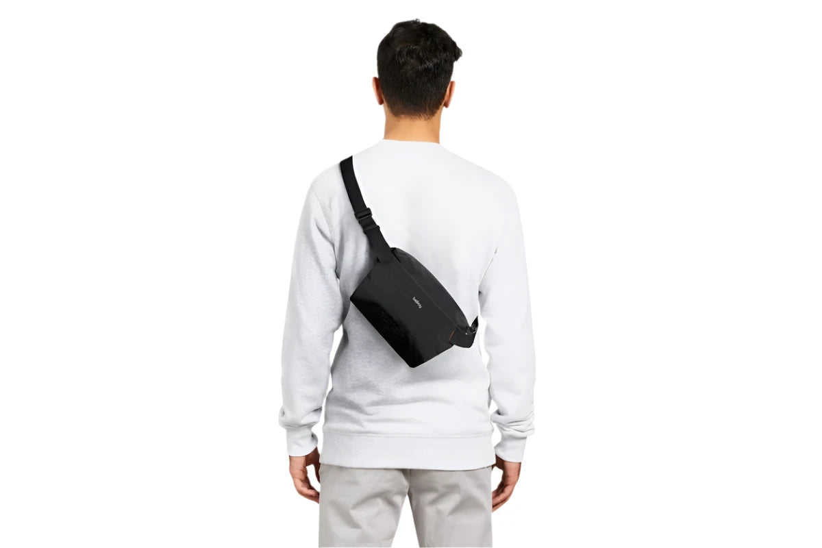 Bellroy Lite Sling Mini shown on the back of a model for size reference 
