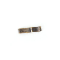 Solid brass money clip with natural patina finish, showing Studebaker PGH USA stamp on white background
