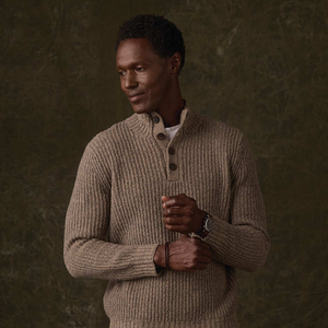 Man wearing Taupe boucle popover sweater with ribbed cuffs, styled with jeans