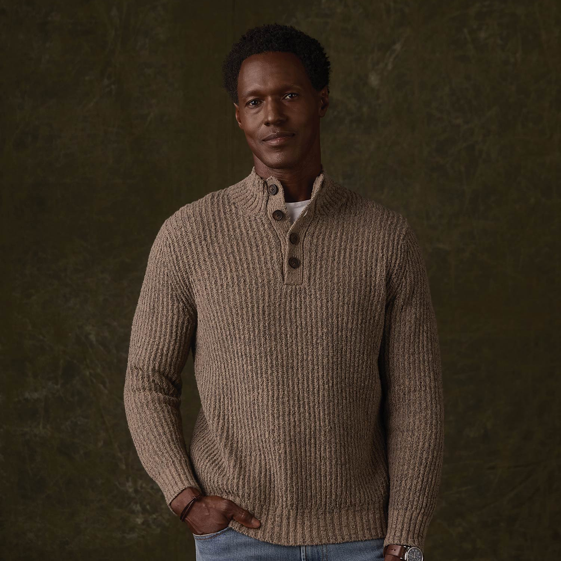 Front view of Taupe two-tone marled popover sweater with hand in pocket
