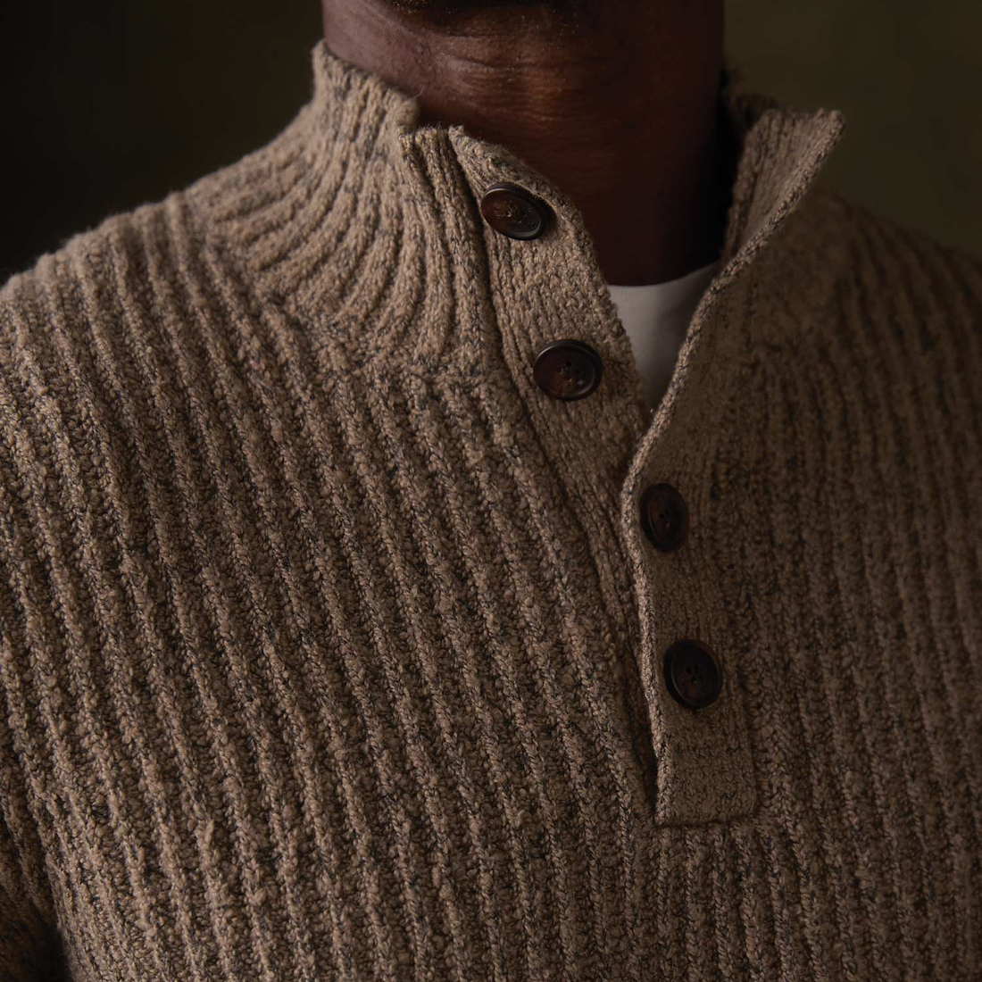 Close up of boucle popover sweater stand collar and button placket in Taupe