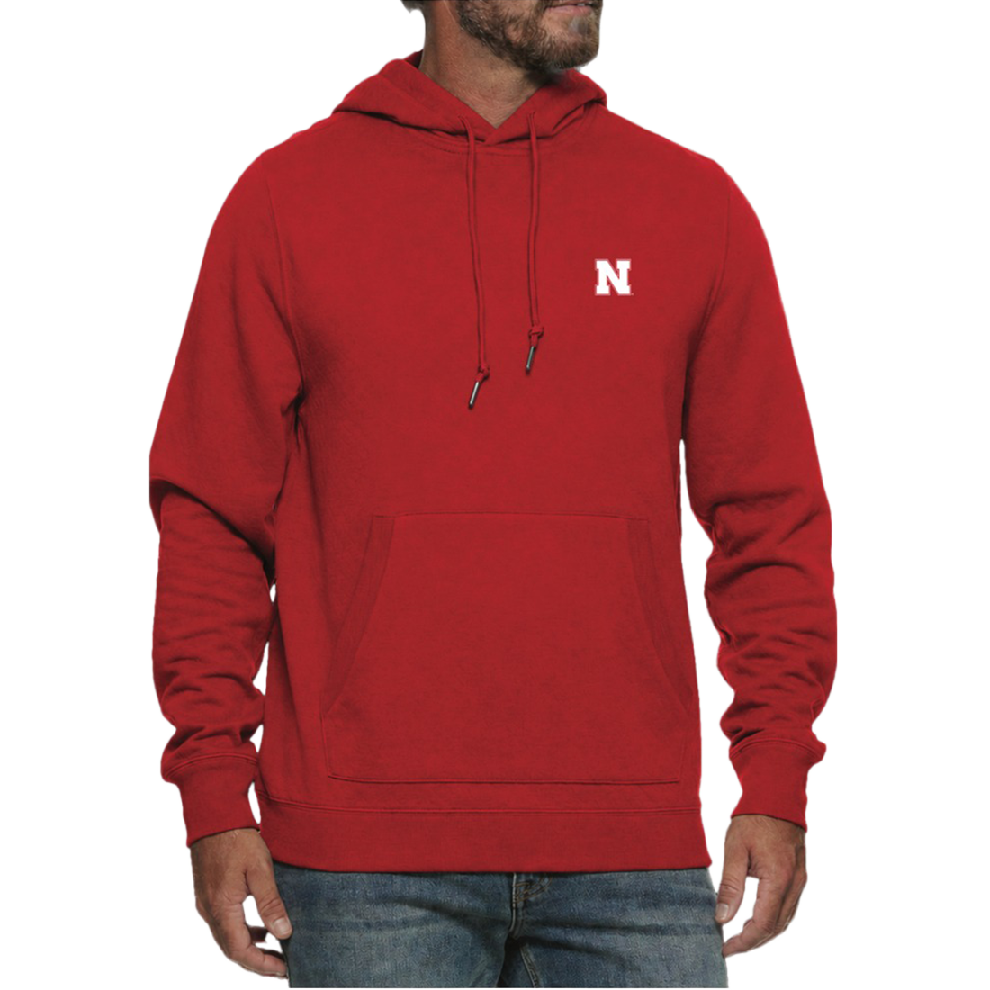 Man wearing a Nebraska Cornhuskers red hooded sweatshirt with a white N on the left chest and jeans