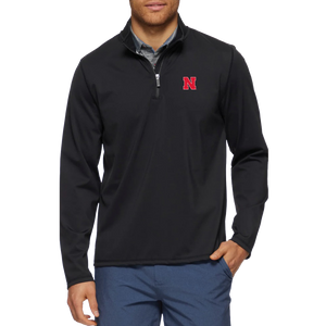 Man wearing a Nebraska Cornhuskers black performance quarter-zip mock neck with a red N on the chest
