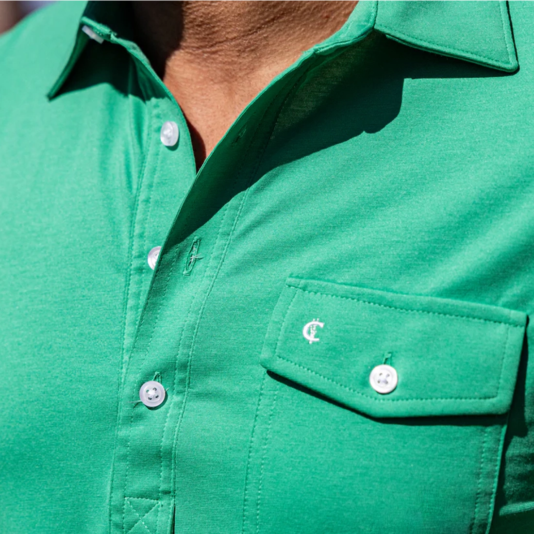 Criquet Performance Players Shirt golf green lifestyle shot on model