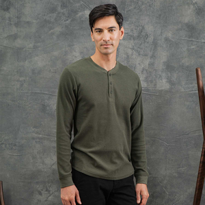 Man wearing the recycled waffle henley in Forest Melange with black pants, front view - The Simple Man