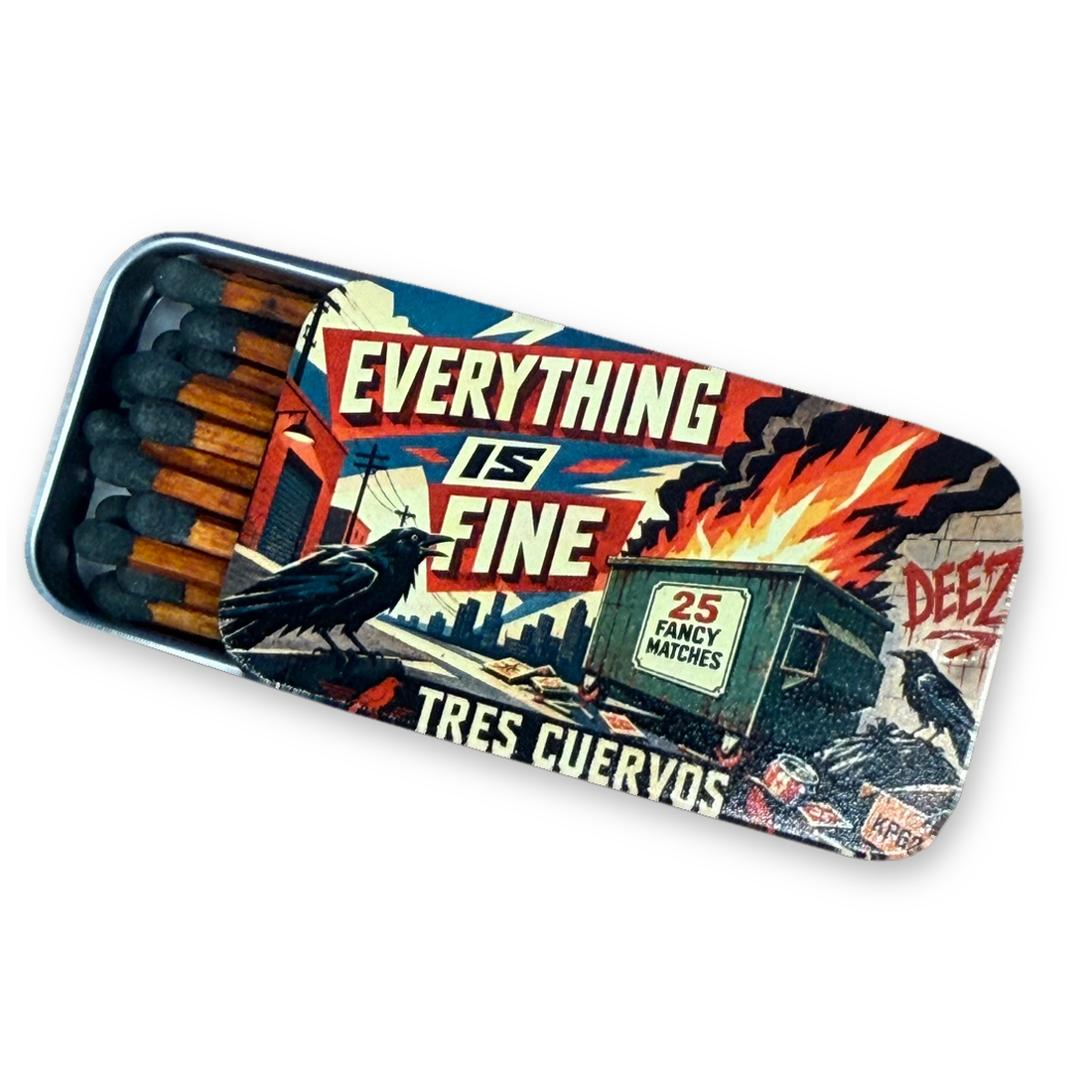 Slide-open tin matchbox with a burning dumpster, two ravens and the words Everything Is Fine on the lid, on a white background