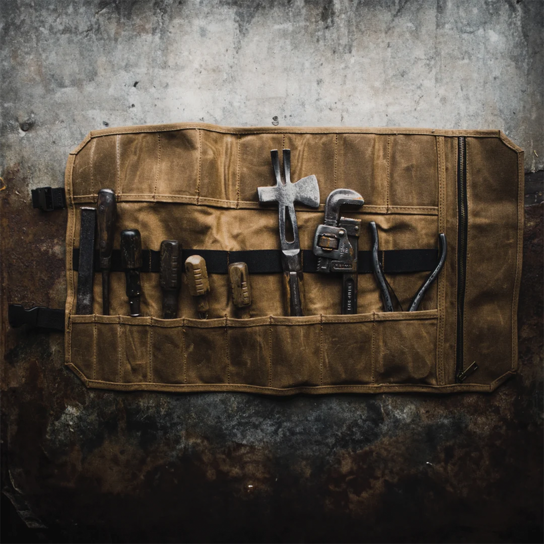 Readywares Tool Roll, lifestyle shot loaded with tools against a rustic background