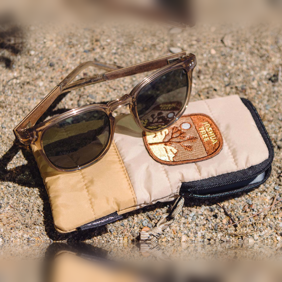 Topo Joshua Tree Edition sunglasses on the Joshua Tree patch pouch in the sun