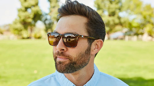 Model wearing Knockaround Fast Lanes Sunglasses in Glossy Tortoise shell with amber lenses, front angled view