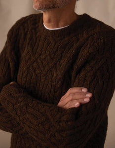 Man wearing dark brown cable knit wool sweater with detailed texture — The Simple Man Omaha