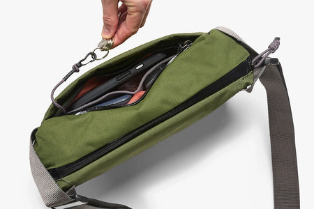Bellroy Venture Sling 6L in Ranger Green Colorway, showing the key tether feature