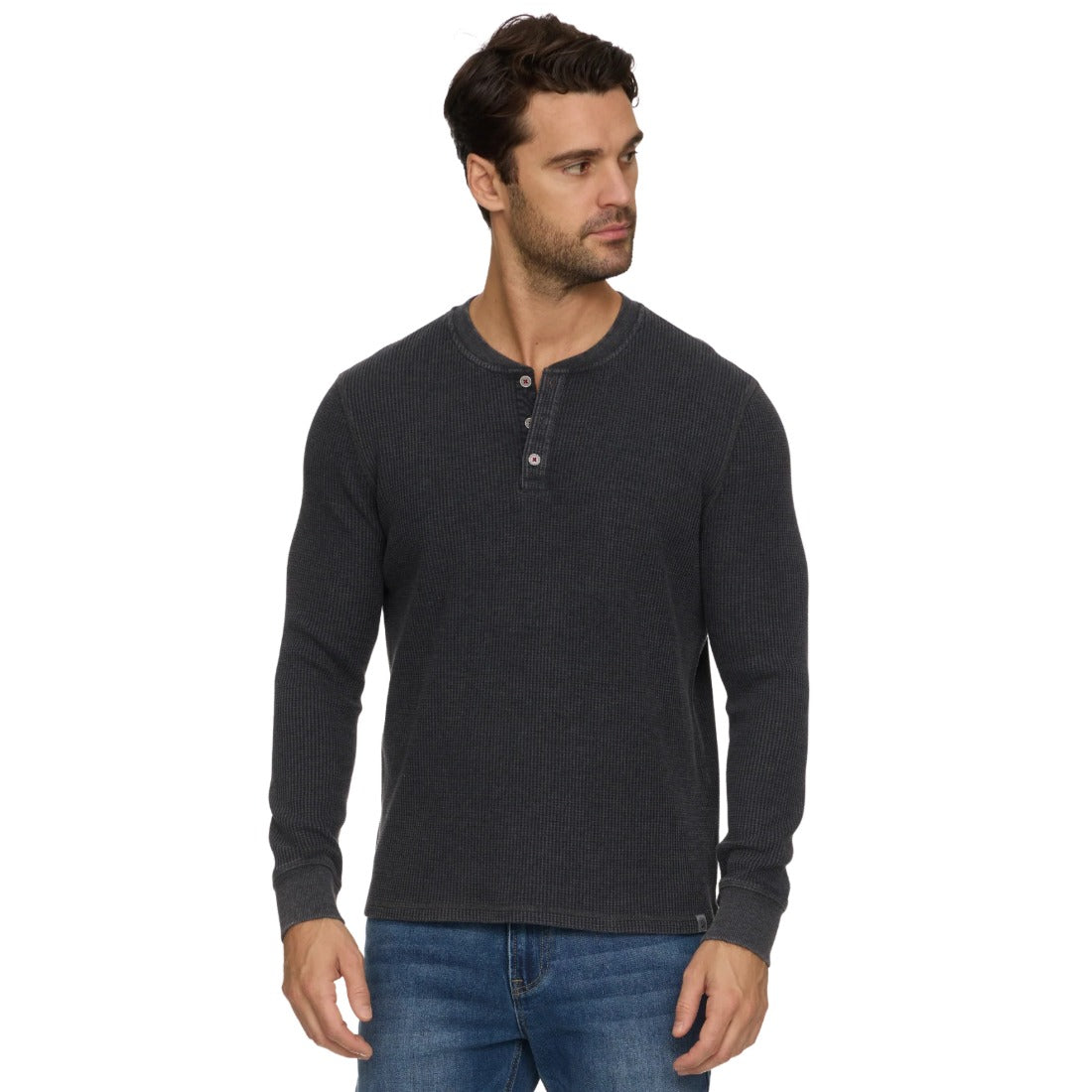 Man wearing the charcoal vintage soft waffle knit henley with jeans, front view