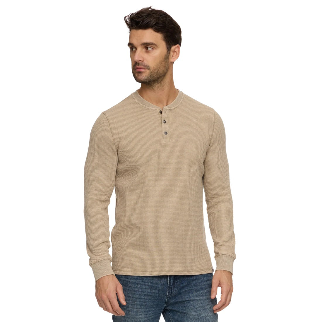 Tan waffle knit long sleeve henley on a model, angled view showing the fit