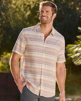 Man wearing Flag and Anthem Westmont linen blend stripe shirt outdoors in golden hour light – short sleeve button-down tailored athletic fit natural stripe