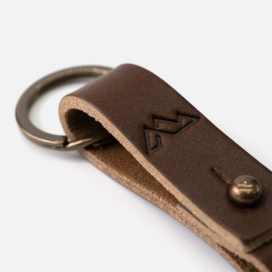 Close-up of full grain leather Wheeler keychain with brass clip