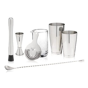 Set of cocktail-making tools including jiggers, shaker, and strainer on a white background