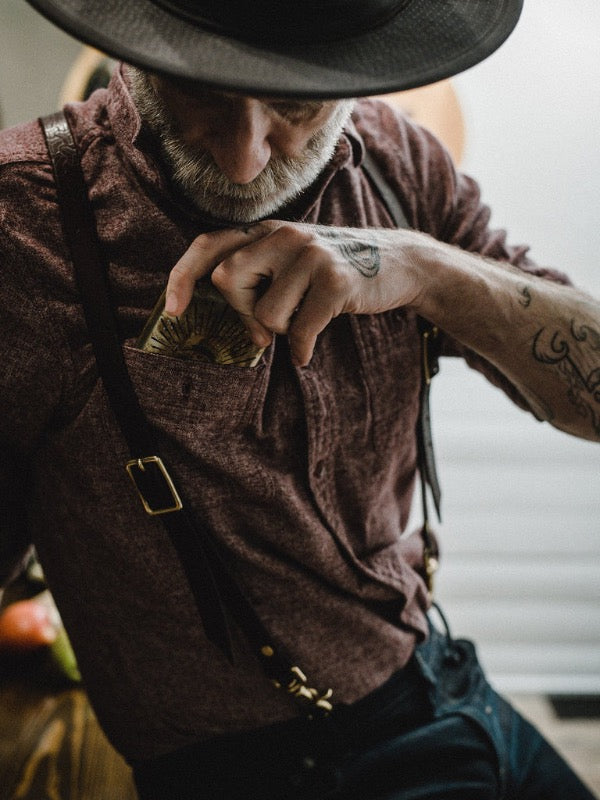 Model displaying noble flask in front shirt pocket