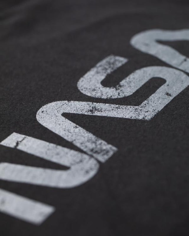 Close up photo of the word NASA printed on the t-shirt