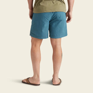 Model Wearing Howler Bros Salado Shorts in Mid Blue rear view