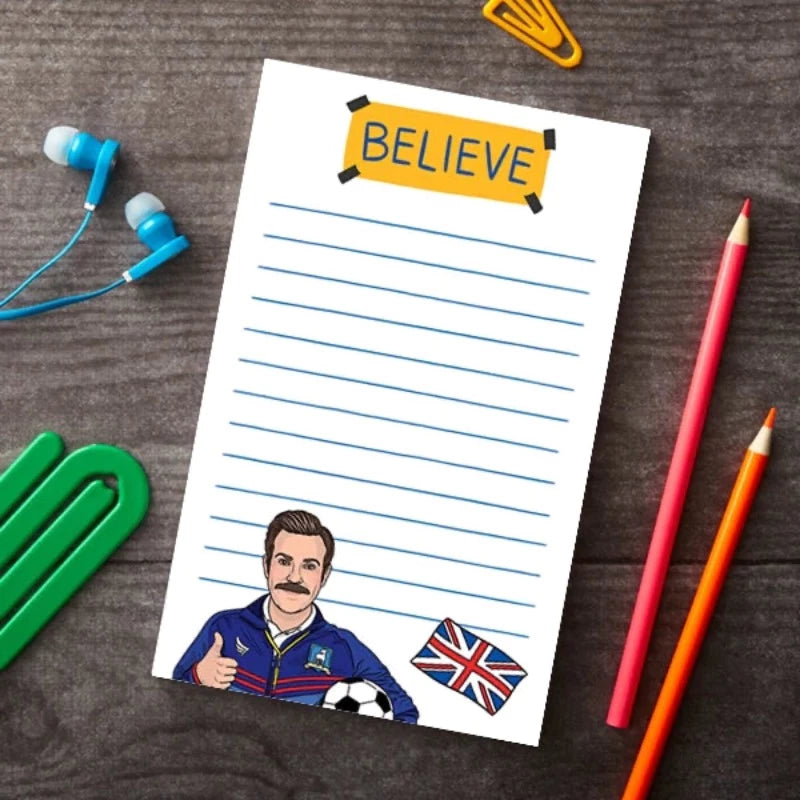 Ted Lasso Believe sign notepad on a table