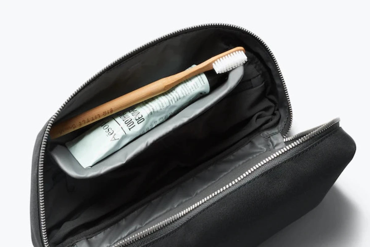 Bellroy Toiletry kit Plus In Charcoal open showing toothbrush storage