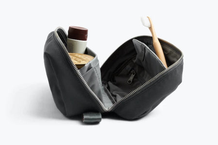 Bellroy Toiletry kit Plus In Charcoal open with example contents side view